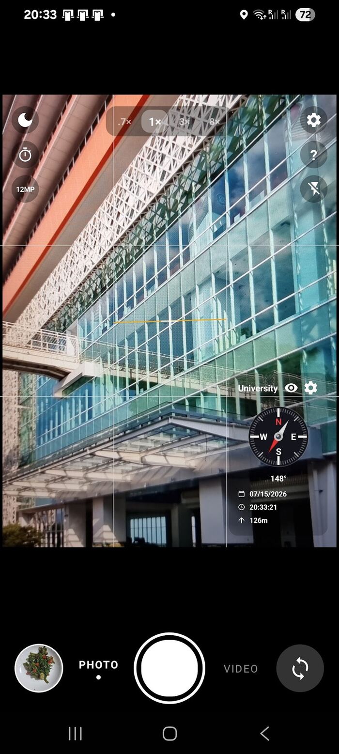 MemoCam viewfinder with live location, compass and date overlay